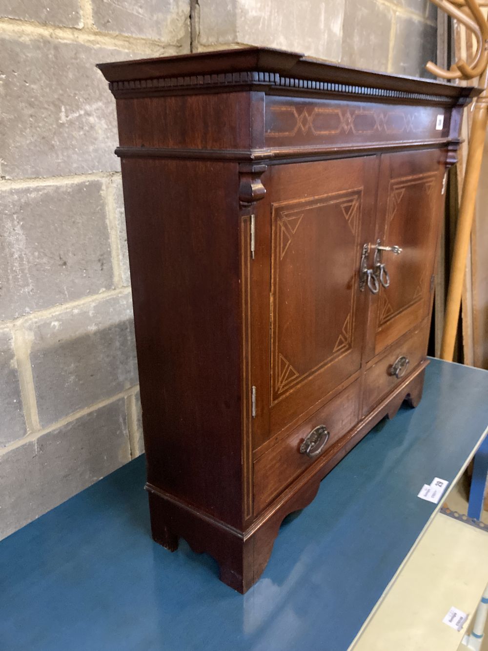 An Edwardian inlaid mahogany two door wall cabinet, width 72cm, depth 22cm, height 65cm